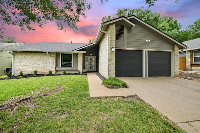 7906 Swindon Ln, Austin, TX 78745 - mid-century home with stone siding, driveway, a garage, a lawn, and roof with shingles
