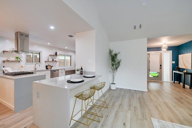 7906 Swindon Ln, Austin, TX 78745 - kitchen featuring open shelves, island range hood, light wood-style flooring, stainless steel dishwasher, and recessed lighting