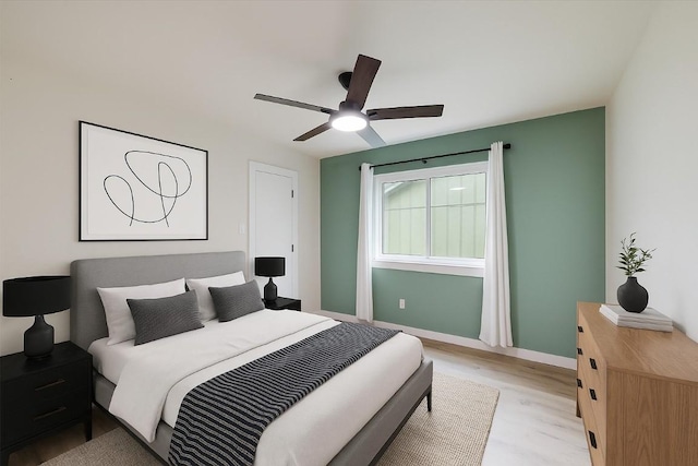 7906 Swindon Ln, Austin, TX 78745 - bedroom featuring light wood finished floors and a ceiling fan