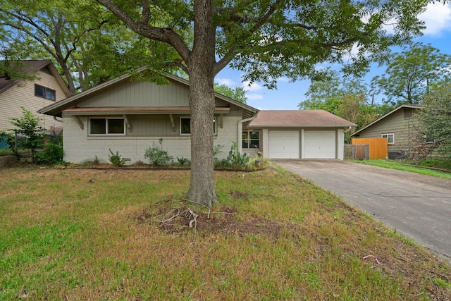 1913 Edgeware Dr, Austin, TX 78704 - ranch-style house with an attached garage, brick siding, and concrete driveway