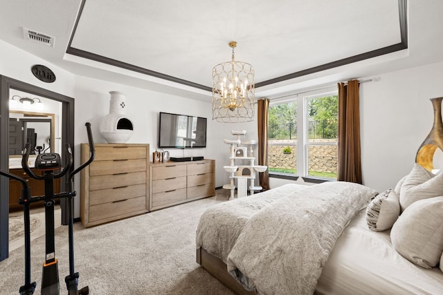614 W Martingale St W, Georgetown, TX 78633 - bedroom with a raised ceiling, light carpet, and a chandelier