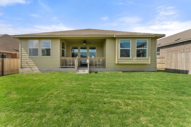 2004 Long Shadow Ln, Georgetown, TX 78628 - back of property featuring a ceiling fan and a fenced backyard