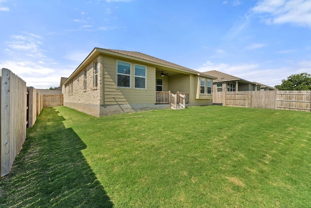 2004 Long Shadow Ln, Georgetown, TX 78628 - rear view of house with ceiling fan and a fenced backyard