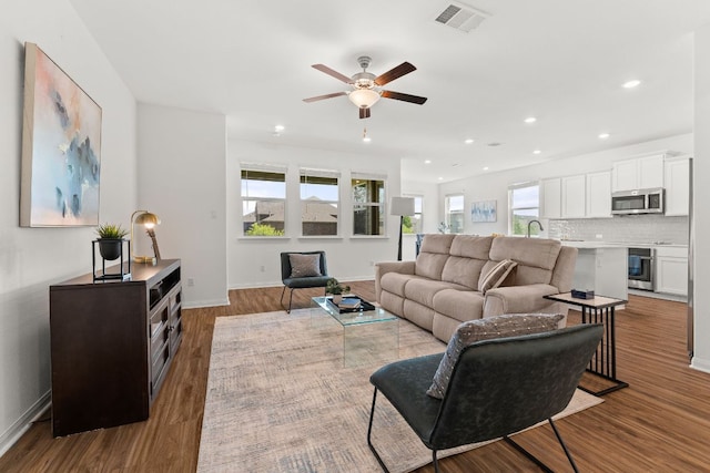 2004 Long Shadow Ln, Georgetown, TX 78628 - living room with ceiling fan, wood finished floors, and recessed lighting