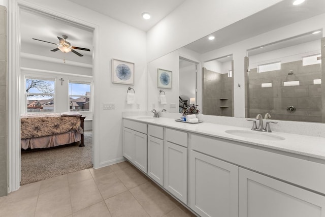 2004 Long Shadow Ln, Georgetown, TX 78628 - bathroom with ensuite bath, double vanity, a ceiling fan, a walk in shower, and tile patterned floors