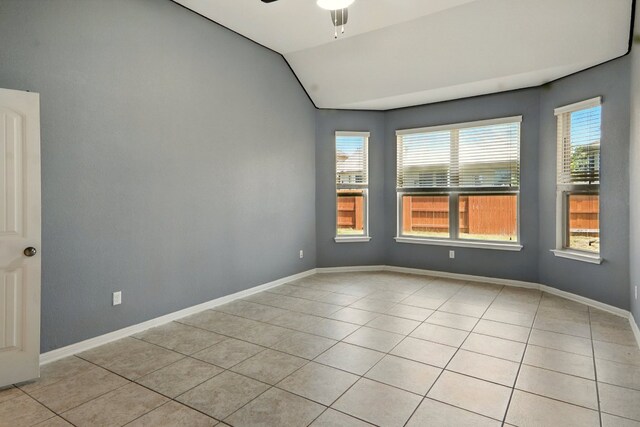 2516 Silver Fern Ln, Pflugerville, TX 78660 - spare room with light tile patterned flooring, a ceiling fan, and vaulted ceiling