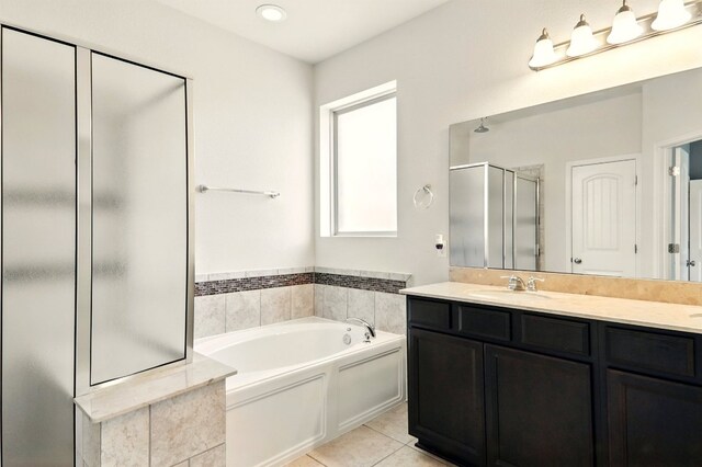 2516 Silver Fern Ln, Pflugerville, TX 78660 - full bath with a stall shower, vanity, a garden tub, and tile patterned flooring