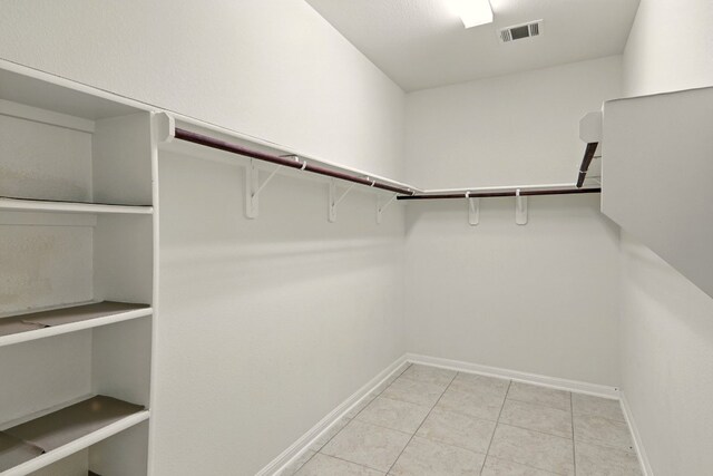 2516 Silver Fern Ln, Pflugerville, TX 78660 - spacious closet featuring light tile patterned floors