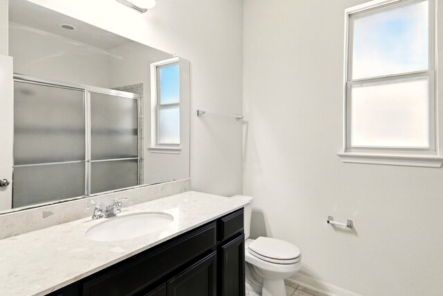2516 Silver Fern Ln, Pflugerville, TX 78660 - bathroom with vanity, a shower with door, and tile patterned flooring