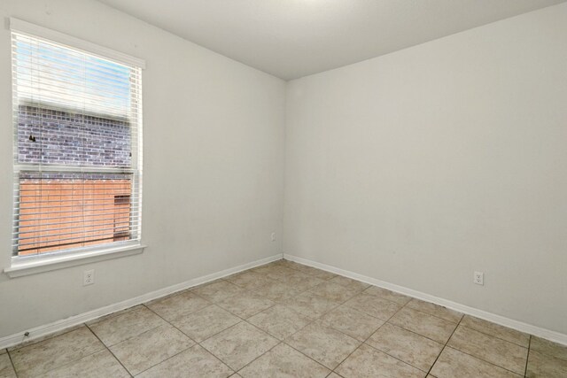 2516 Silver Fern Ln, Pflugerville, TX 78660 - spare room with baseboards and light tile patterned floors