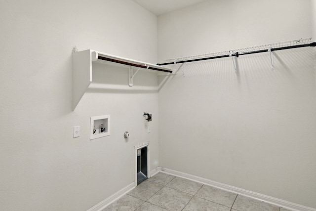 2516 Silver Fern Ln, Pflugerville, TX 78660 - laundry area with gas dryer hookup, light tile patterned floors, and washer hookup
