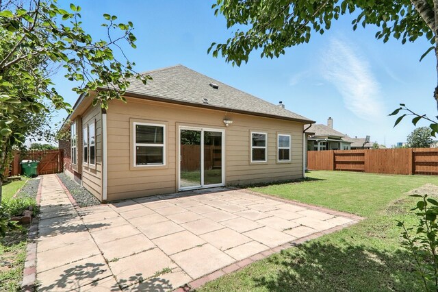 2516 Silver Fern Ln, Pflugerville, TX 78660 - back of house featuring a fenced backyard, a patio area, and roof with shingles