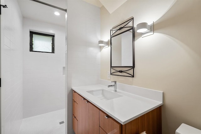 419 Brady Ln, Austin, TX 78746 - bathroom featuring vanity and tiled shower