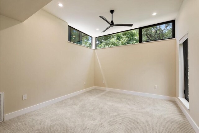 419 Brady Ln, Austin, TX 78746 - unfurnished room featuring ceiling fan, light carpet, and recessed lighting