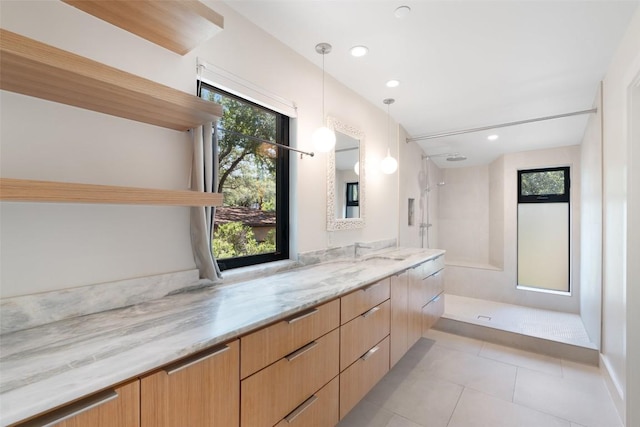 419 Brady Ln, Austin, TX 78746 - bathroom featuring a walk in shower, vanity, tile patterned flooring, and recessed lighting