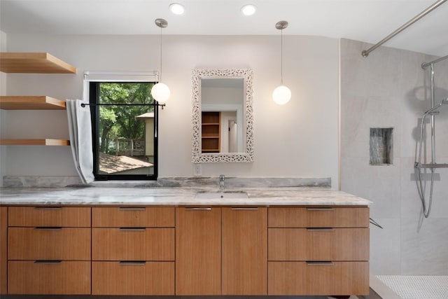 419 Brady Ln, Austin, TX 78746 - full bathroom featuring tiled shower, vanity, and recessed lighting