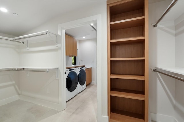 419 Brady Ln, Austin, TX 78746 - laundry room with separate washer and dryer, cabinet space, light tile patterned floors, and recessed lighting