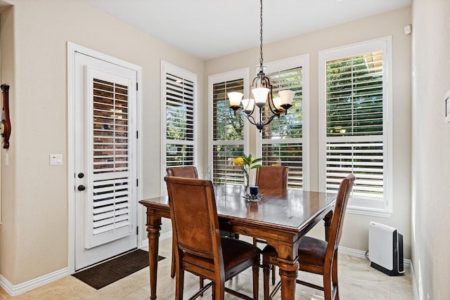 128 Lady Bird Ln, Georgetown, TX 78628 - dining area with a chandelier and healthy amount of natural light
