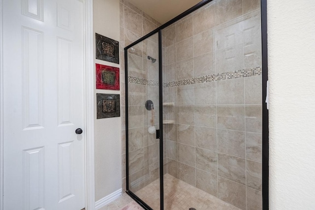 128 Lady Bird Ln, Georgetown, TX 78628 - full bath with a stall shower and baseboards