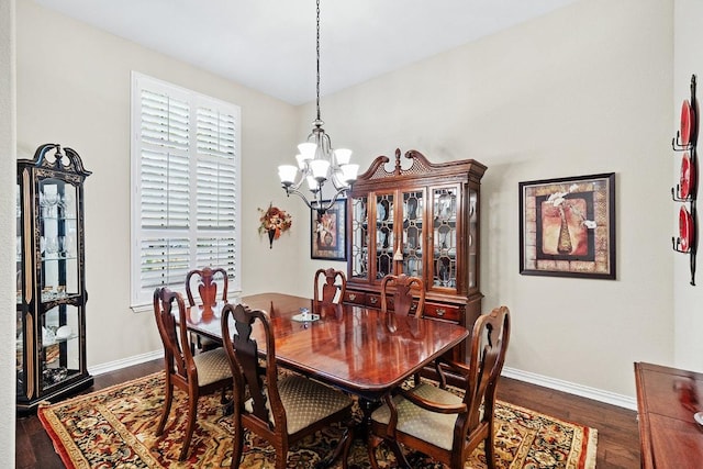 128 Lady Bird Ln, Georgetown, TX 78628 - dining space with a chandelier and dark wood-style flooring