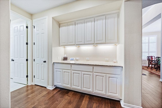 128 Lady Bird Ln, Georgetown, TX 78628 - bar featuring dark wood finished floors