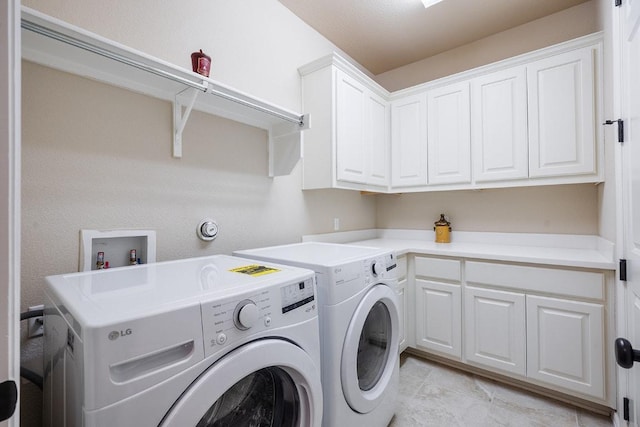 128 Lady Bird Ln, Georgetown, TX 78628 - laundry room with washer and dryer, cabinet space, and light tile patterned flooring