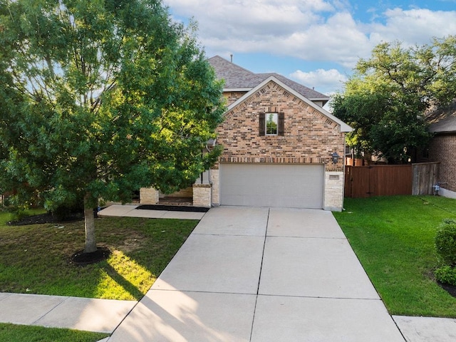 128 Lady Bird Ln, Georgetown, TX 78628 - view of front facade featuring an attached garage, brick siding, and concrete driveway