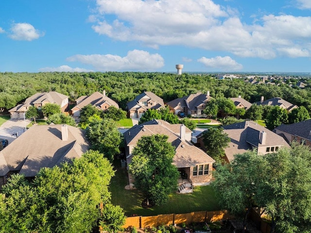 128 Lady Bird Ln, Georgetown, TX 78628 - aerial perspective of suburban area with a heavily wooded area