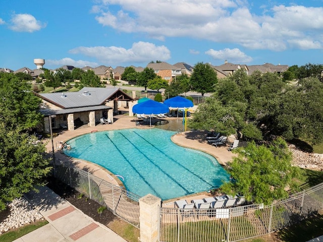 128 Lady Bird Ln, Georgetown, TX 78628 - community pool with a patio area and a residential view