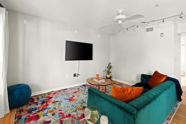 living area with rail lighting and ceiling fan
