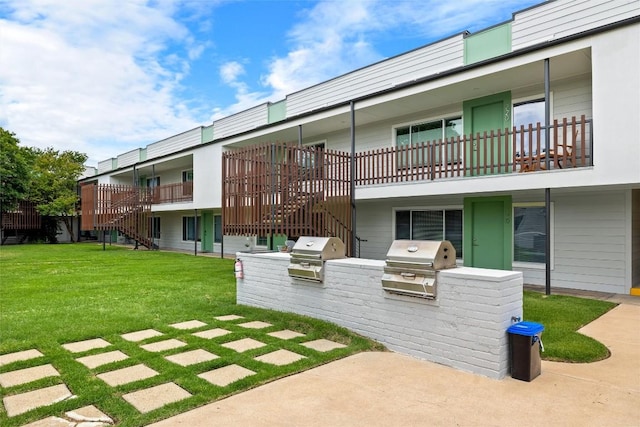 view of patio / terrace with exterior kitchen and stairs