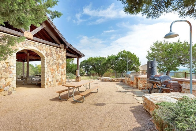 17800 Edgewood Way Unit 203, Jonestown, TX 78645 - view of patio featuring exterior kitchen