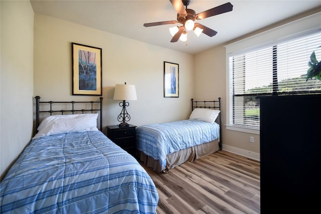 17800 Edgewood Way Unit 203, Jonestown, TX 78645 - bedroom featuring wood finished floors and ceiling fan