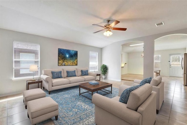 12701 Paloma Blanca Way, Del Valle, TX 78617 - living area featuring arched walkways, light tile patterned floors, and ceiling fan