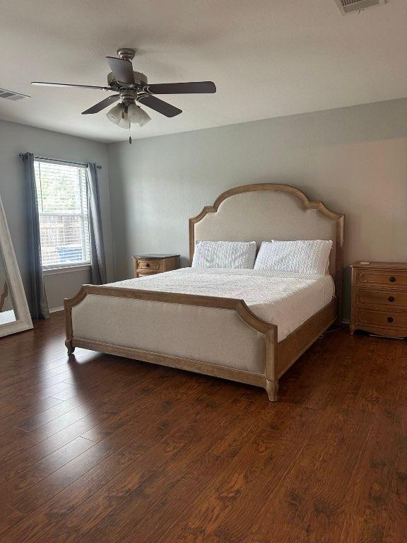 12701 Paloma Blanca Way, Del Valle, TX 78617 - bedroom with wood finished floors and ceiling fan
