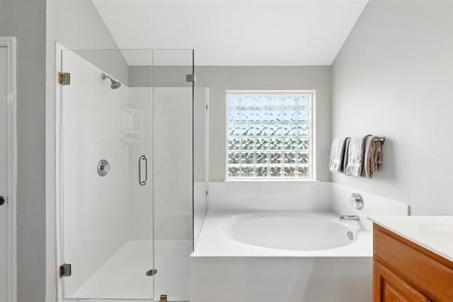 909 Rochester Castle Way, Pflugerville, TX 78660 - bathroom with a bath, a shower stall, and vanity