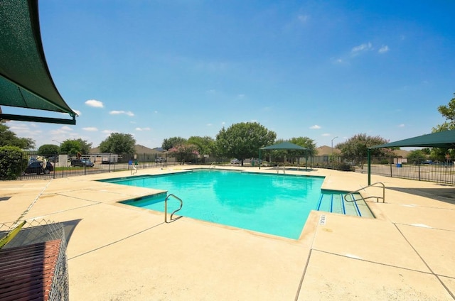 909 Rochester Castle Way, Pflugerville, TX 78660 - community pool featuring a patio area