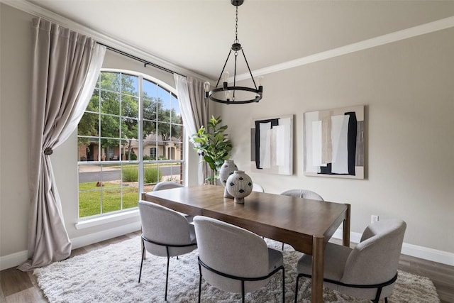 4604 Hibiscus Valley Dr, Austin, TX 78739 - dining area with a chandelier, wood finished floors, and ornamental molding