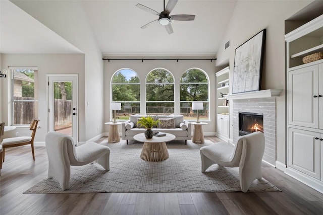 4604 Hibiscus Valley Dr, Austin, TX 78739 - living room with ceiling fan, wood finished floors, a fireplace, and high vaulted ceiling