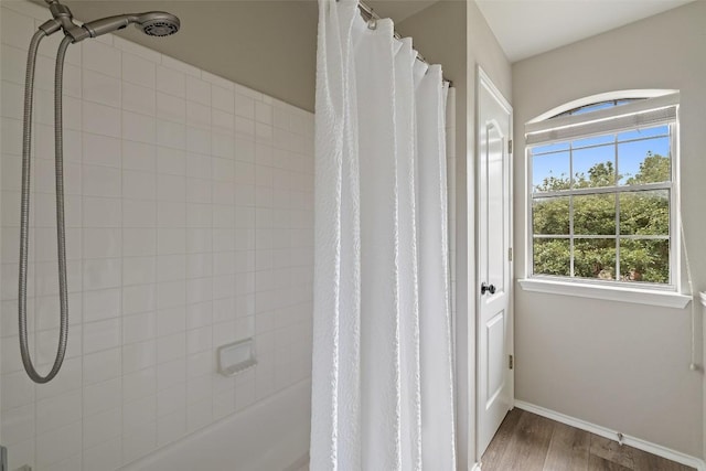 4604 Hibiscus Valley Dr, Austin, TX 78739 - full bathroom featuring wood finished floors and shower / tub combo