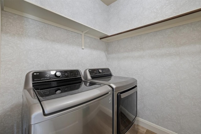 4604 Hibiscus Valley Dr, Austin, TX 78739 - laundry area with separate washer and dryer and wood finished floors