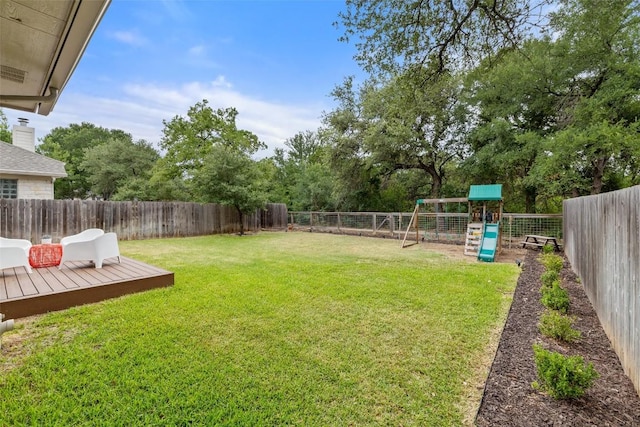 4604 Hibiscus Valley Dr, Austin, TX 78739 - fenced backyard featuring a playground and a wooden deck