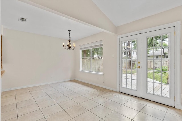 9400 Canus Dr, Austin, TX 78748 - unfurnished dining area with light tile patterned floors, a chandelier, french doors, and vaulted ceiling