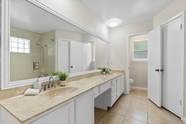 9400 Canus Dr, Austin, TX 78748 - full bath with double vanity, tile patterned floors, and a tile shower