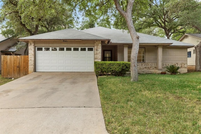 9400 Canus Dr, Austin, TX 78748 - single story home featuring a garage, driveway, brick siding, a porch, and a shingled roof