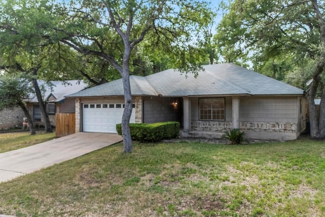 9400 Canus Dr, Austin, TX 78748 - ranch-style home featuring a garage, driveway, and a front yard