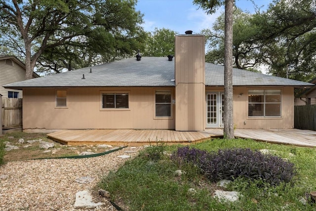 9400 Canus Dr, Austin, TX 78748 - back of house with a deck, a chimney, and roof with shingles