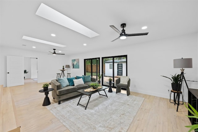 1305 Ridgehaven Dr, Austin, TX 78723 - living area with ceiling fan, a skylight, light wood-style floors, and recessed lighting