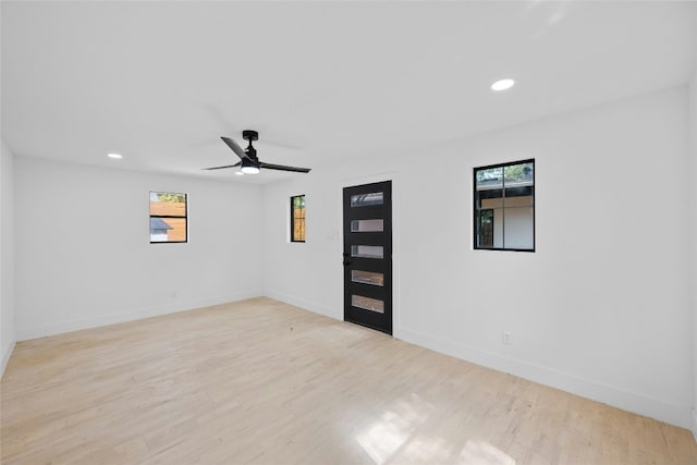 1305 Ridgehaven Dr, Austin, TX 78723 - spare room with plenty of natural light, light wood finished floors, recessed lighting, and ceiling fan