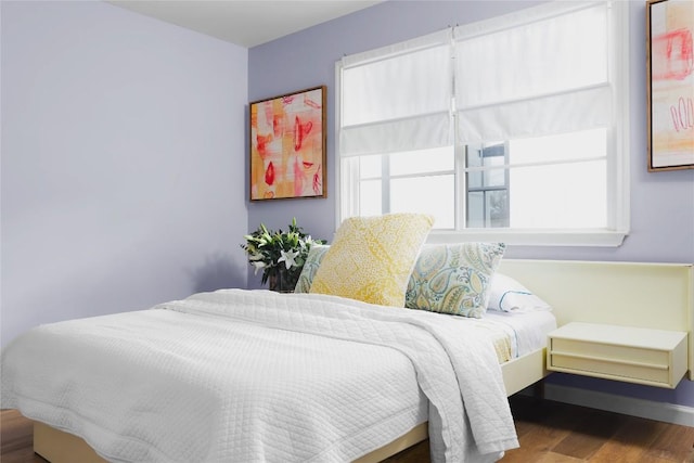 2410 W 9th St, Austin, TX 78703 - bedroom featuring multiple windows and wood finished floors